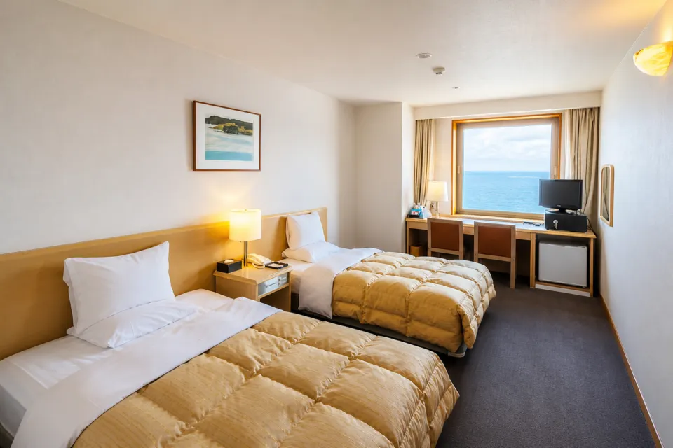 HOTEL OOSADOのスタンダードツインの2台のベッド